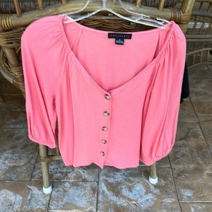 Sanctuary top looks pink in photo but definitely salmon color.